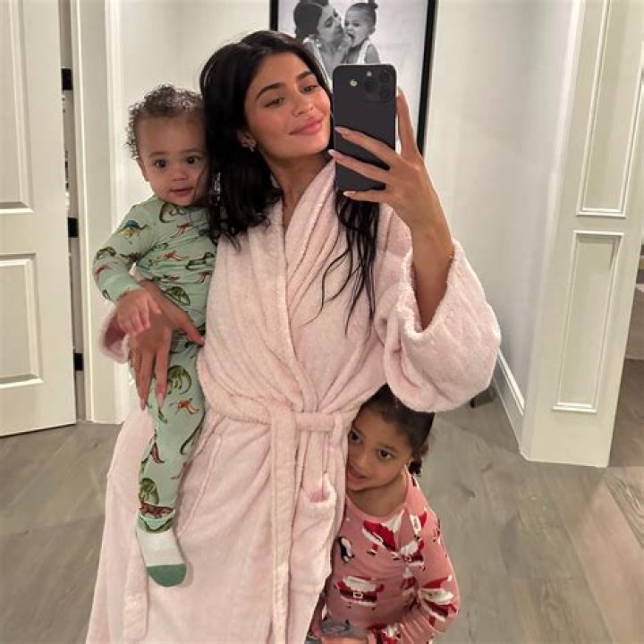 Kylie Jenner Wears Green Bikini Top & Skirt While Playing With Stormi, 4, On Vacation